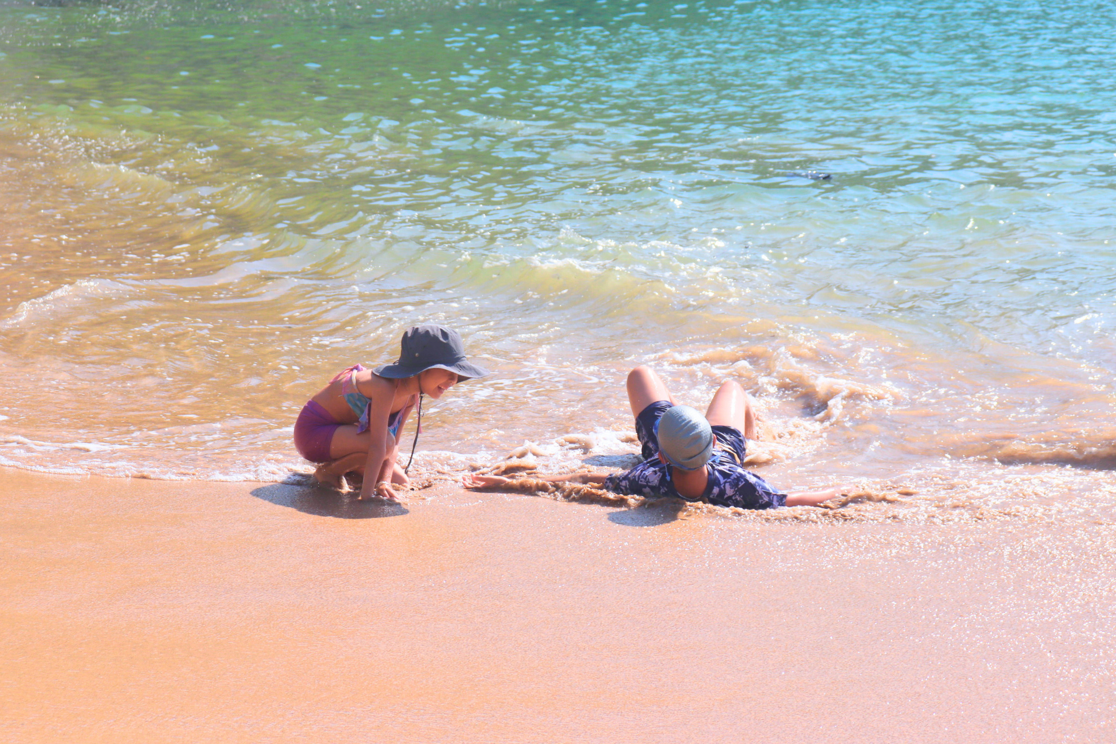Children playing on Cat Co 1 Beach