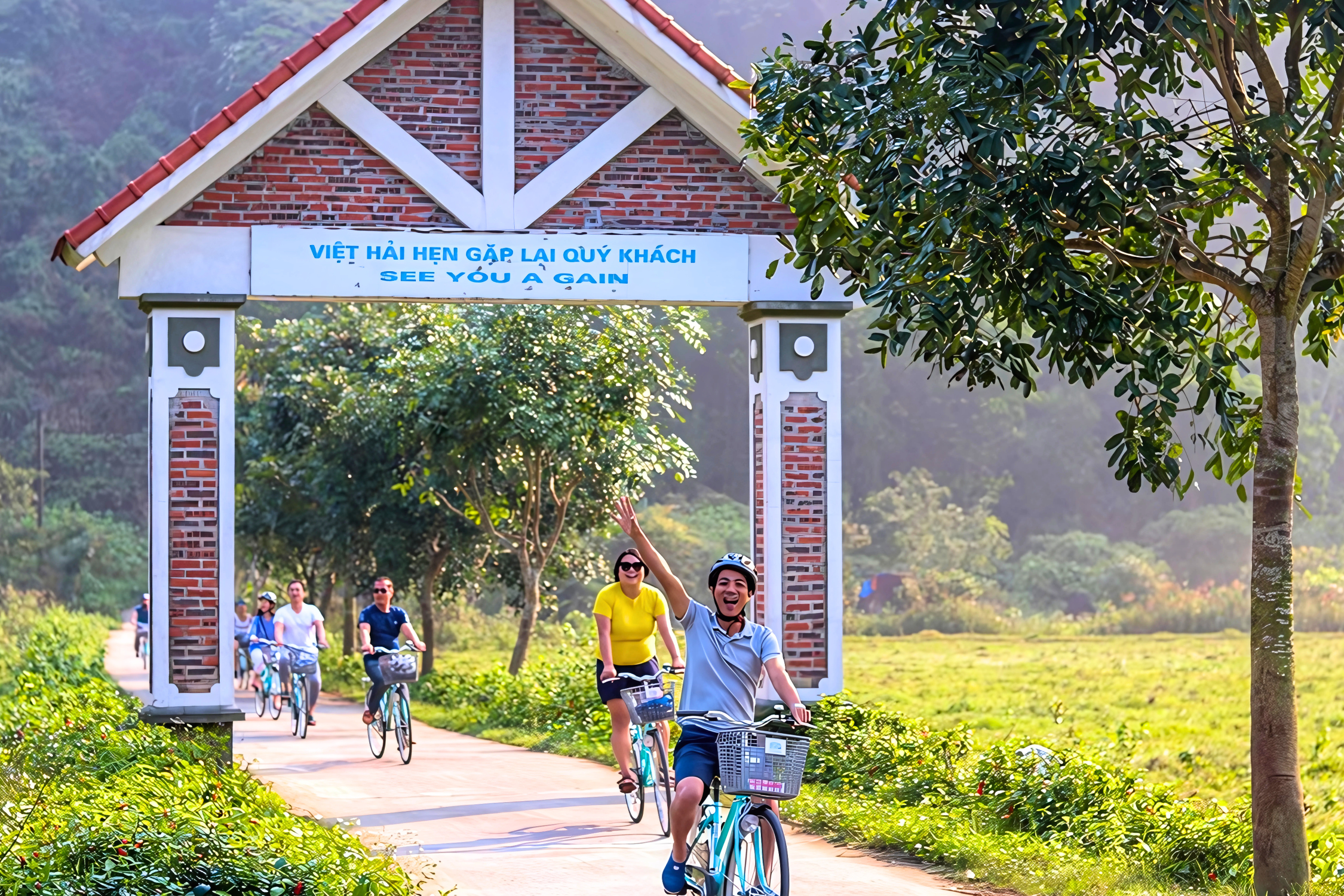 Tourists enjoy cycling in the ancient village Viet Hai